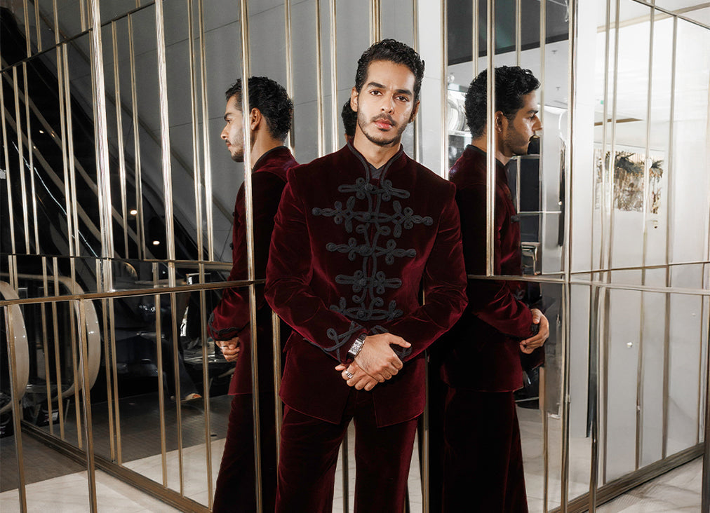ISHAAN KHATTER MAKES HIS RED CARPET DEBUT AT THE CANNES FILM FESTIVAL IN A CUSTOM DEEP BORDEAUX VELVET BANDHGALA