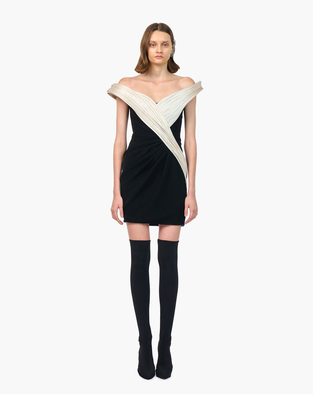 Woman wearing black & white outfit by Gaurav Gupta