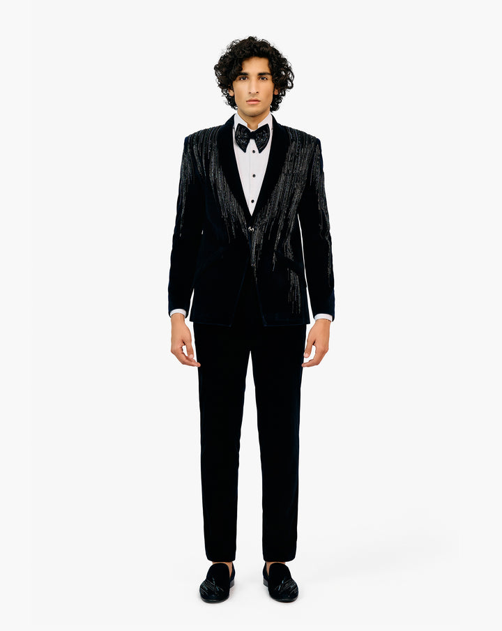 Man in a black tuxedo with bow tie by Gaurav Gupta
