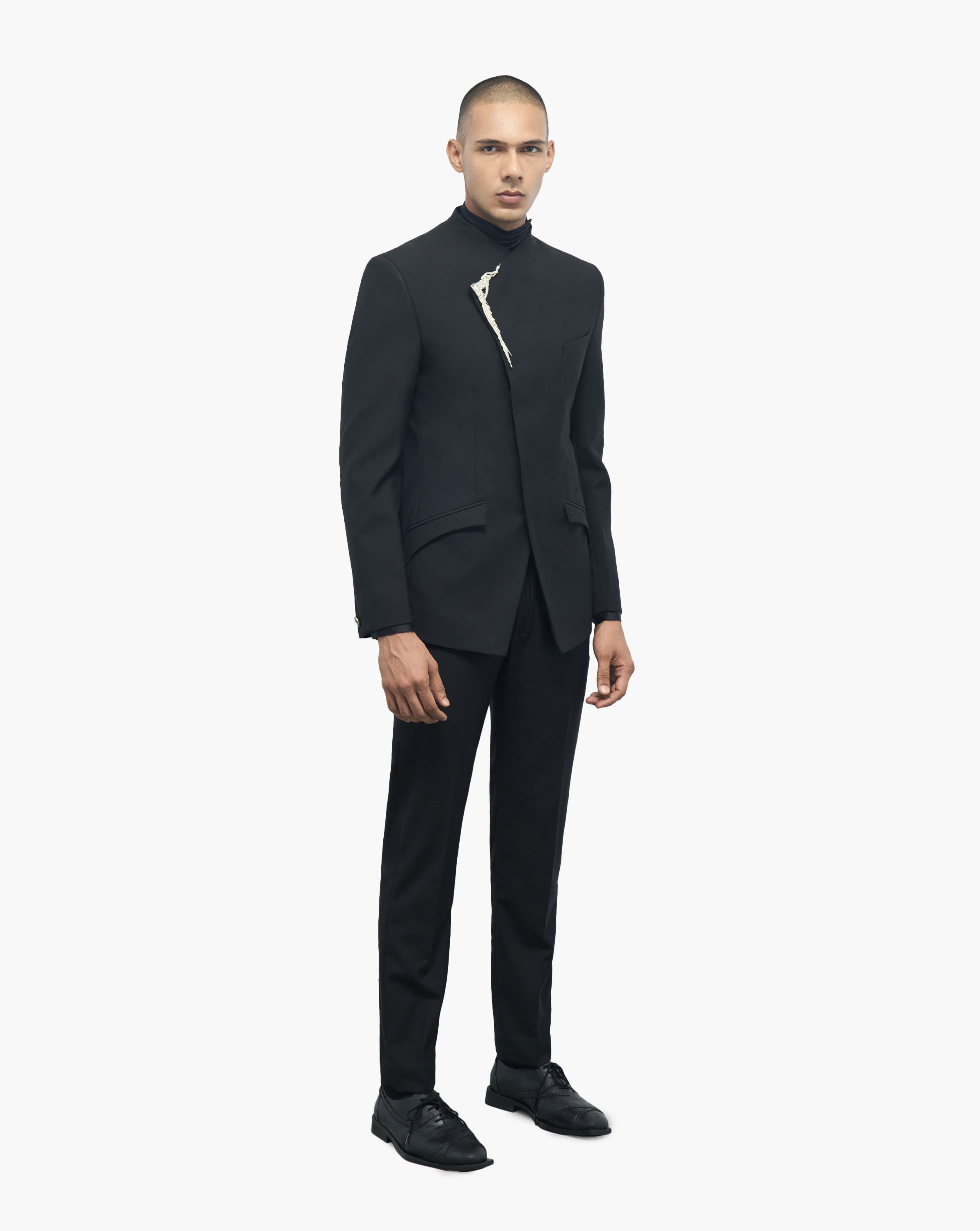 Front side view look of man wearing black suit by Gaurav Gupta