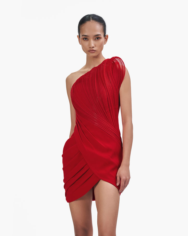 Woman wearing red short ruffle dress by Gaurav Gupta