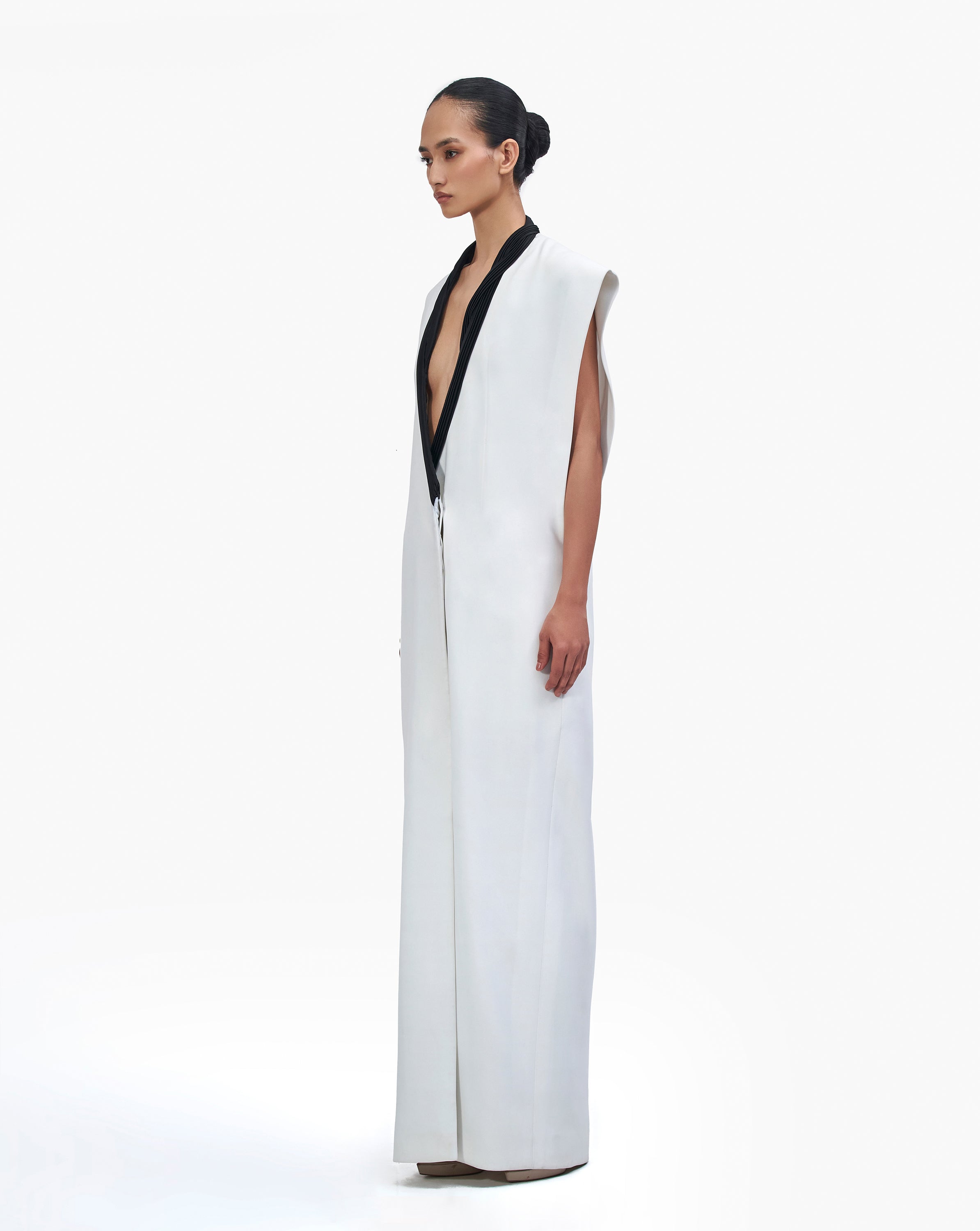 side view look of woman wearing a white dress by Gaurav Gupta