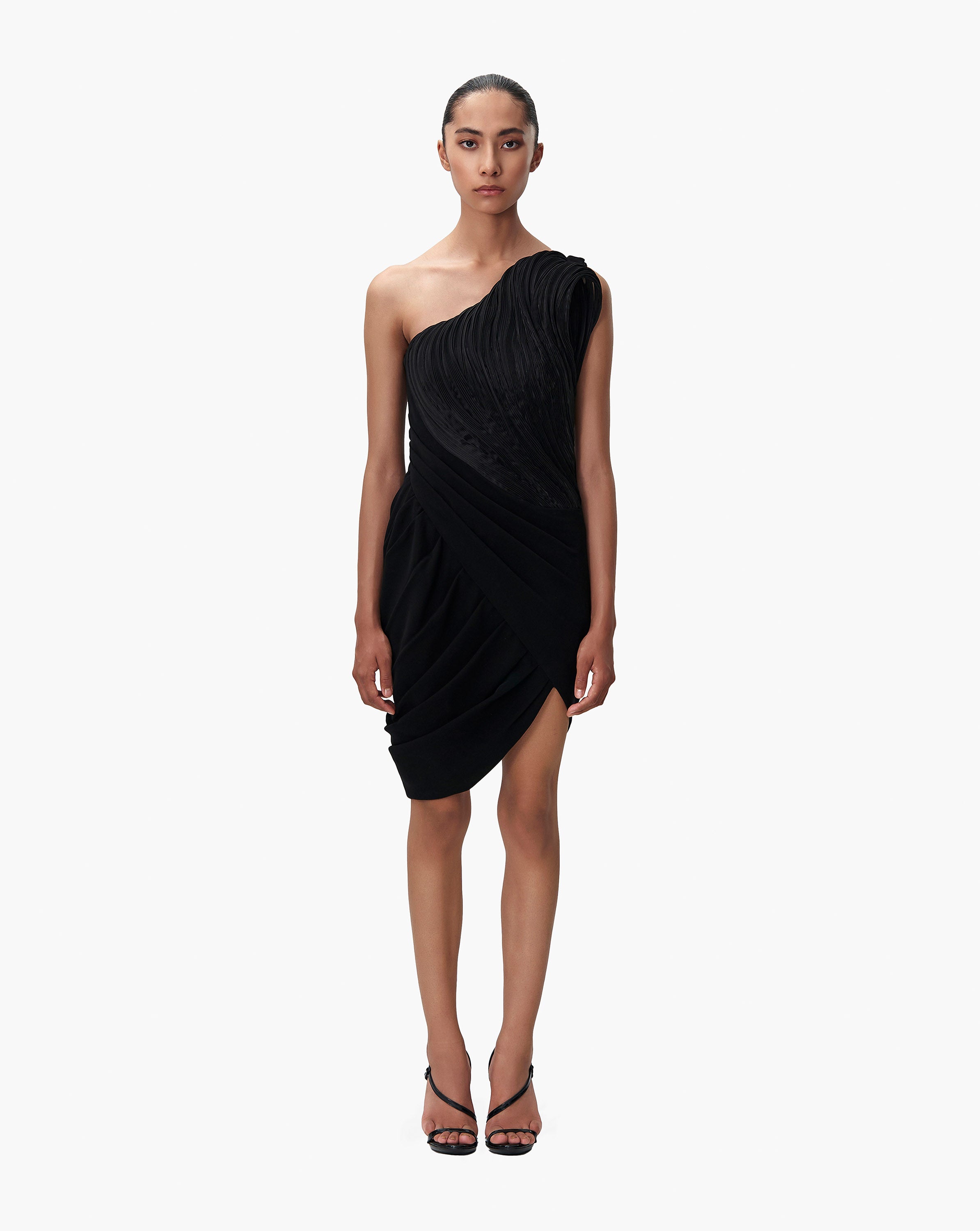 Model wearing black dress by Gaurav Gupta