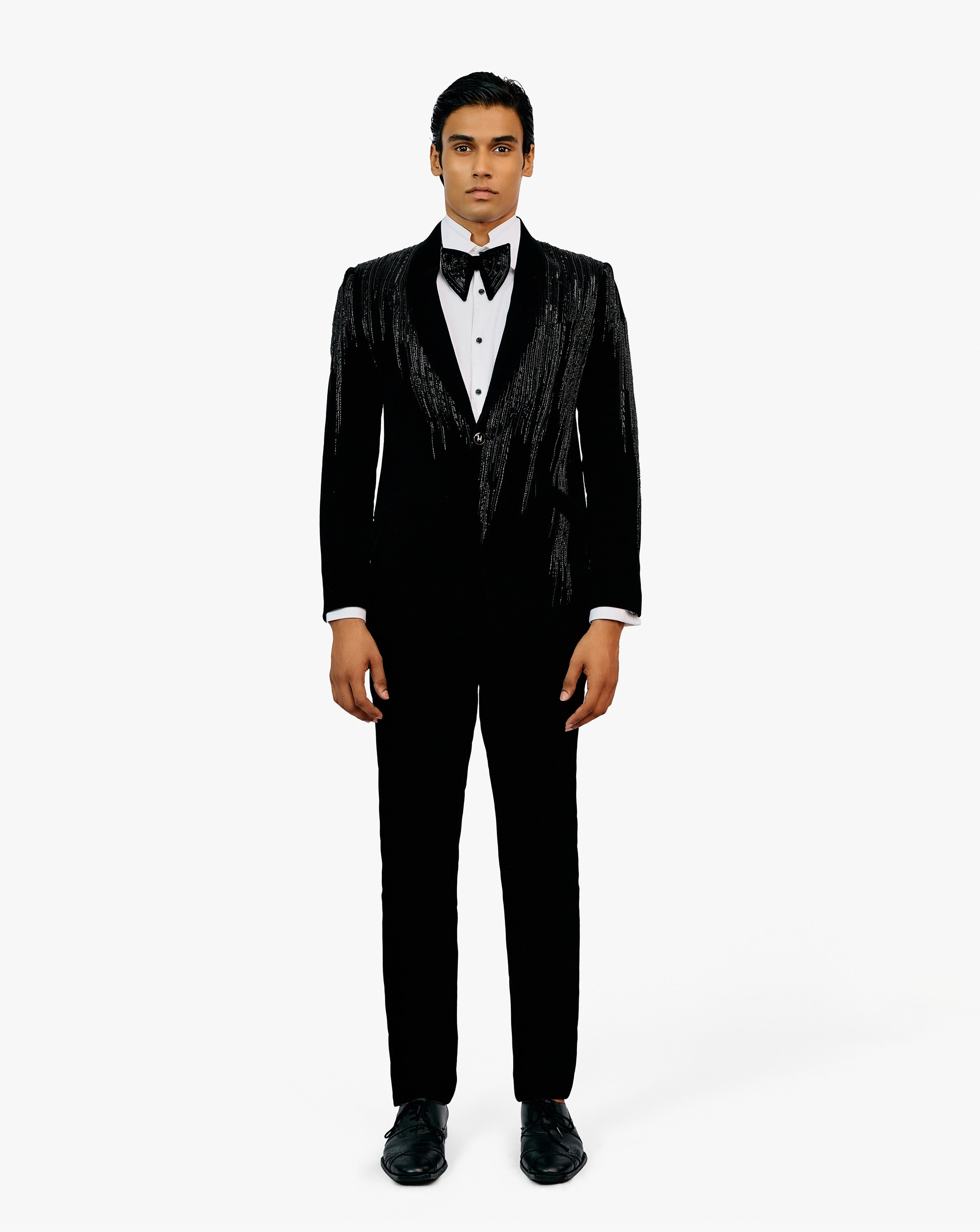 Model wearing black suit set by Gaurav Gupta