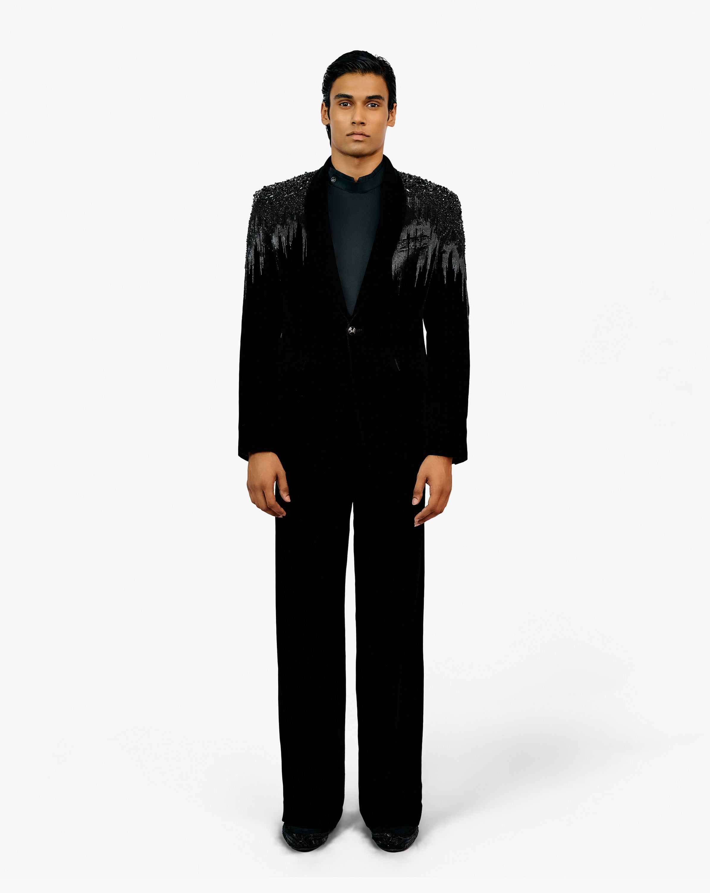 Front look of model wearing black suit set by Gaurav Gupta