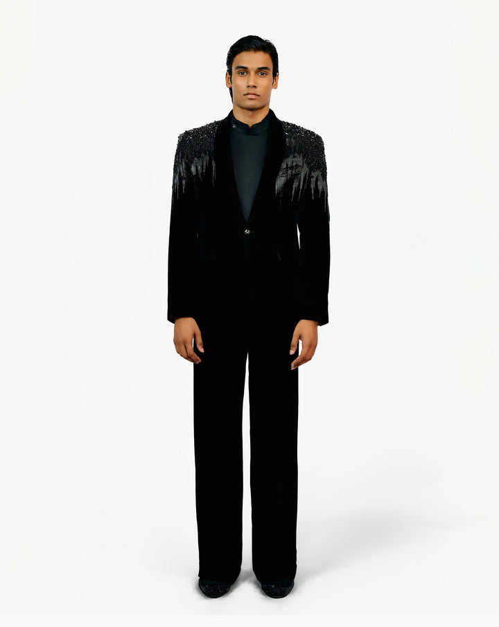 Front look of model wearing black suit set by Gaurav Gupta