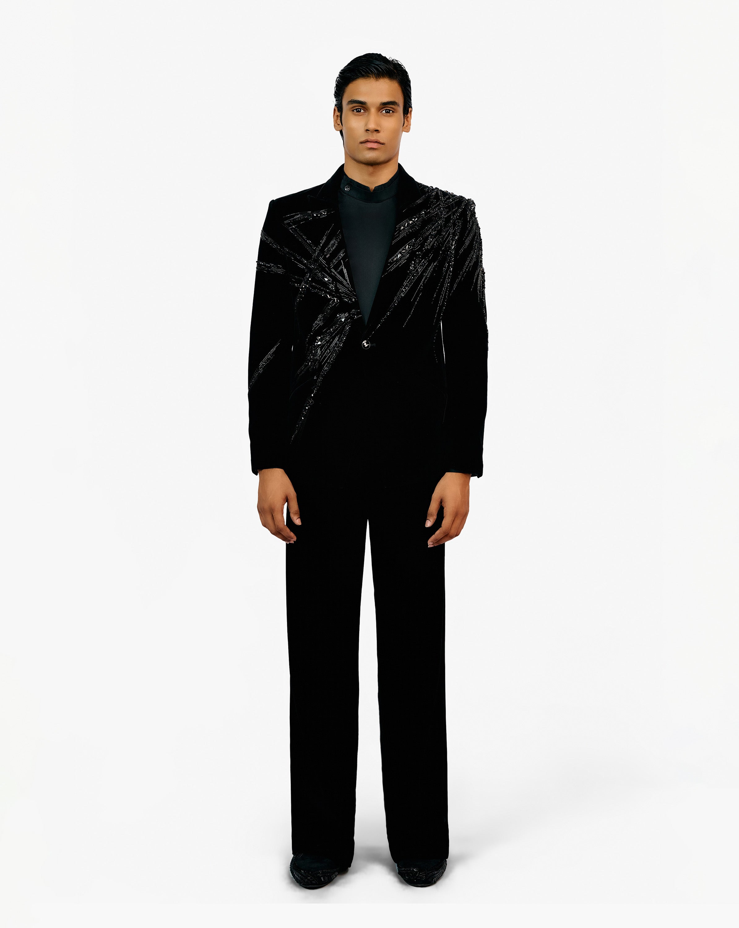 Man in black embroidered set suit by Gaurav Gupta