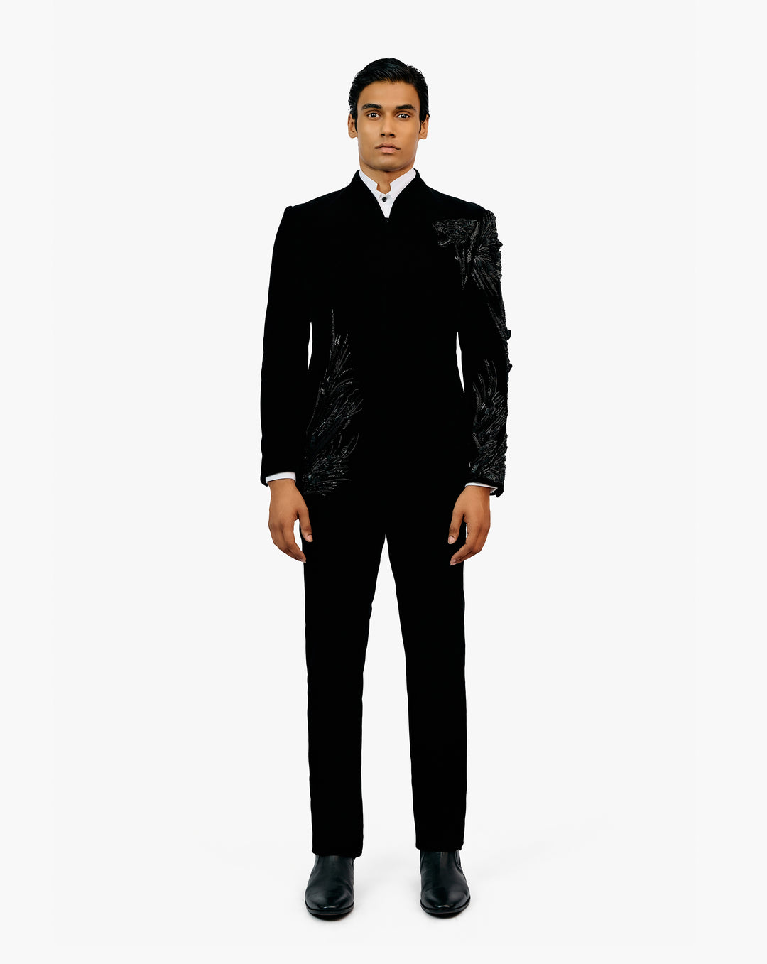 Model wearing black suit by Gaurav Gupta