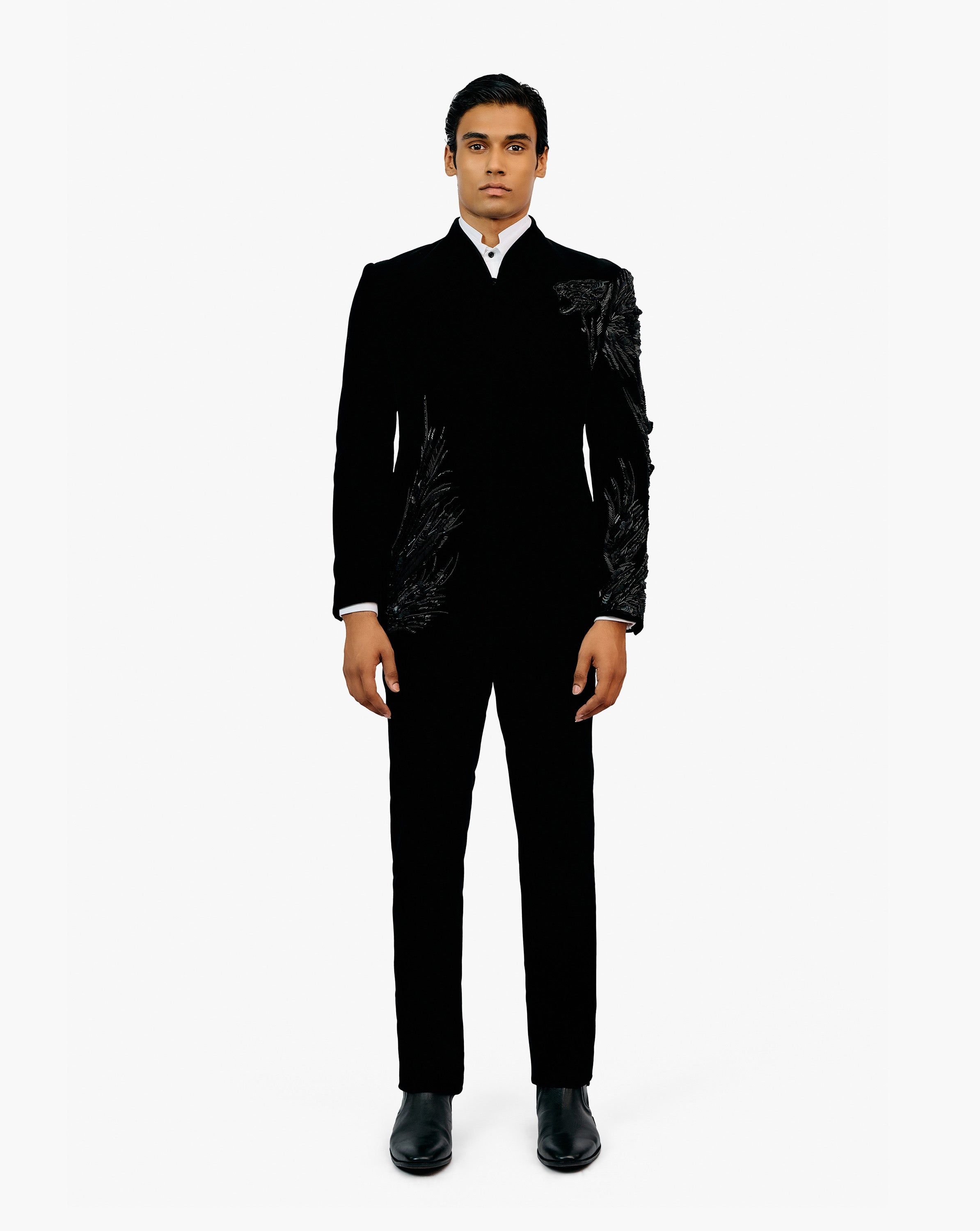 Model wearing black suit by Gaurav Gupta