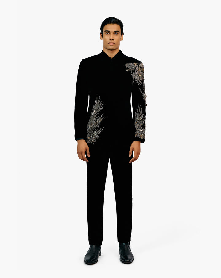 Model wearing a black embroidered sherwani set by Gaurav Gupta
